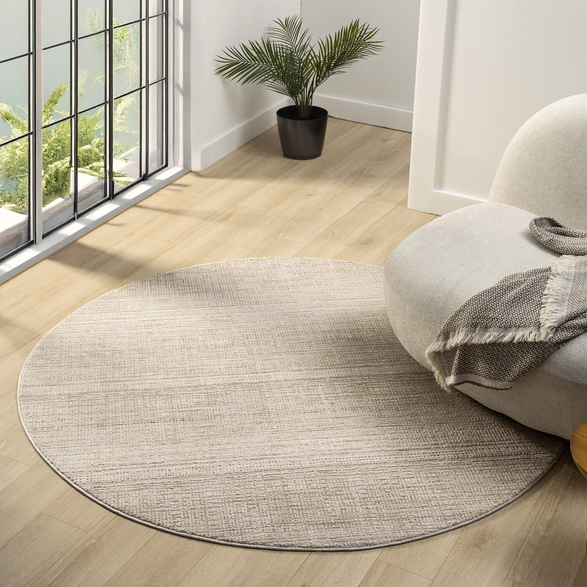 Le Canvas Mira Sand Round — styled in a living room