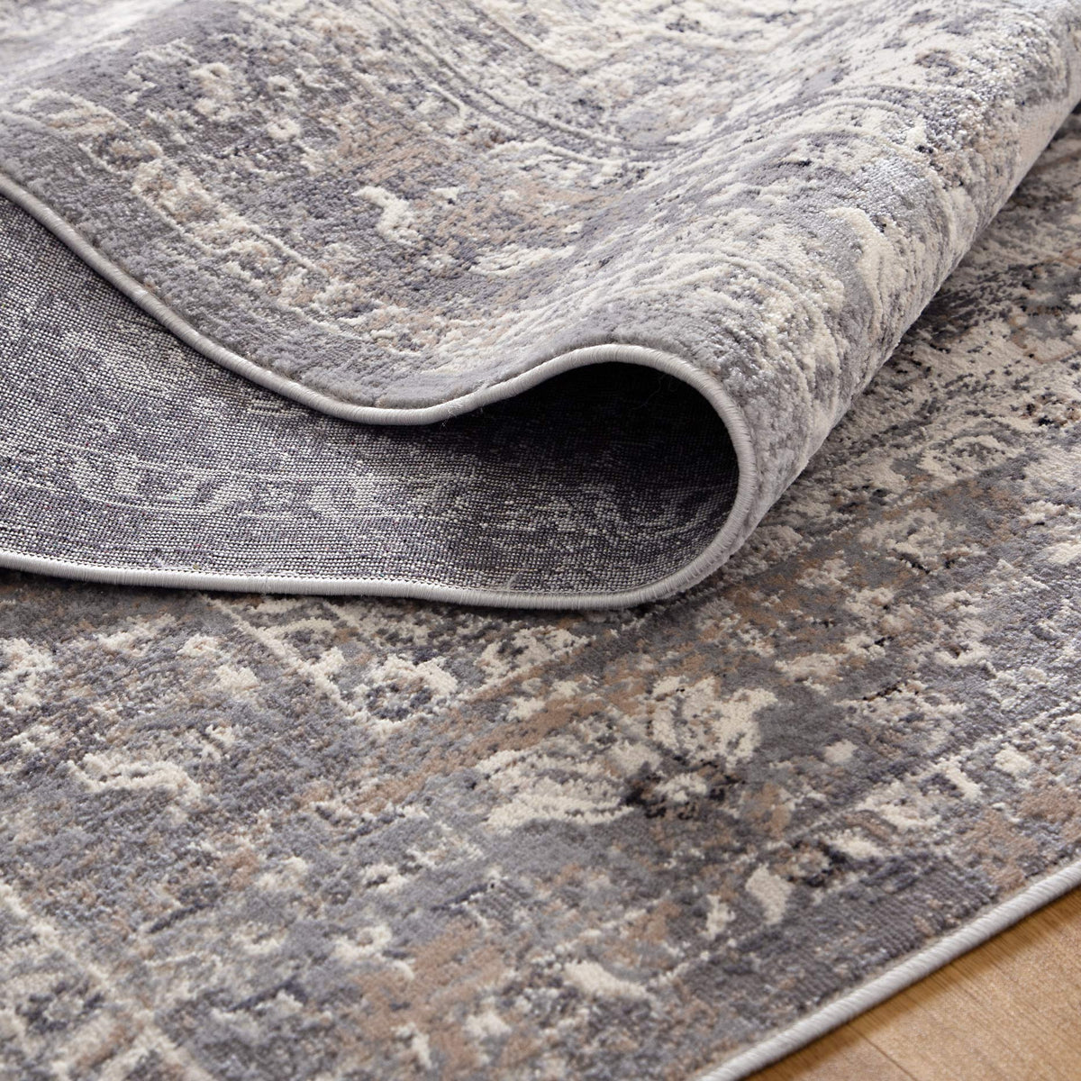 Le Canvas Oriel — Grey rug, showing rug back weave and edge finish