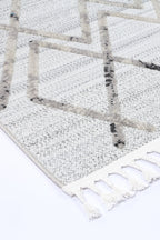 Le Canvas Helia — Cream and taupe rug, corner and tassel detail
