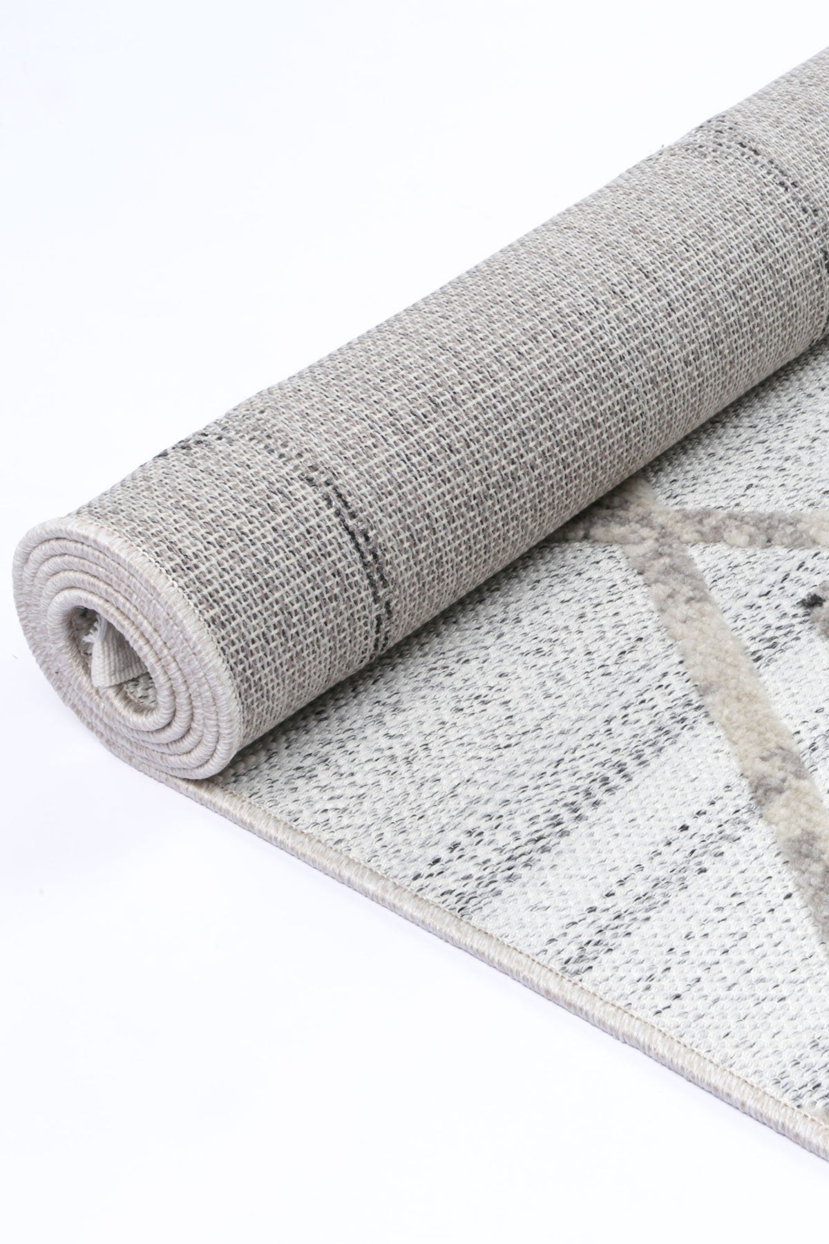 Le Canvas Helia — Cream and taupe rug, showing rug back weave and edge finish