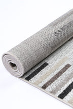 Le Canvas Ione — Stone and grey rug, showing rug back weave and edge finish