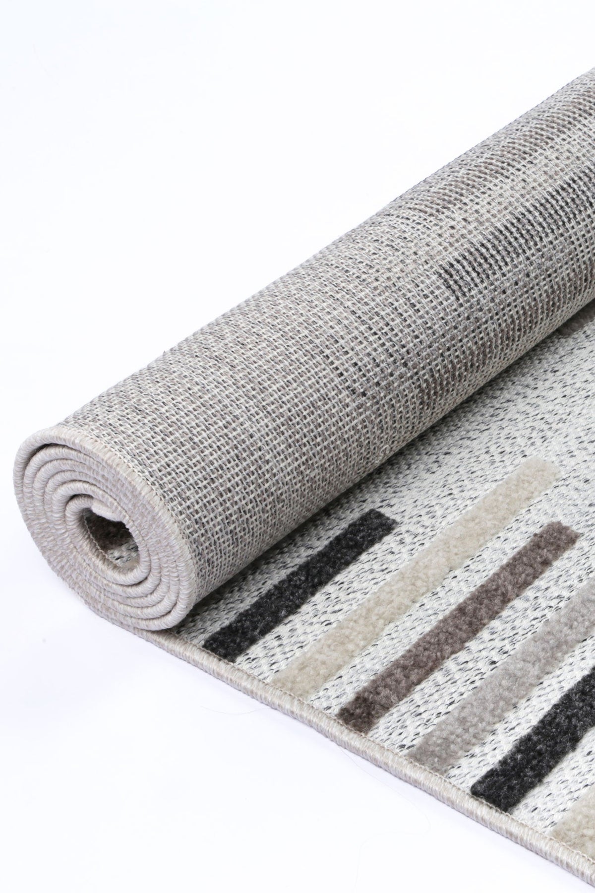 Le Canvas Ione — Stone and grey rug, showing rug back weave and edge finish