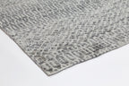 Le Canvas Kira — Grey tribal-geometric rug, showing rug back weave and edge finish