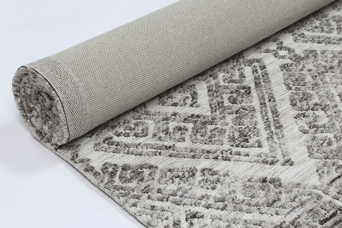 Le Canvas Fara — Grey tribal rug, showing rug back weave and edge finish