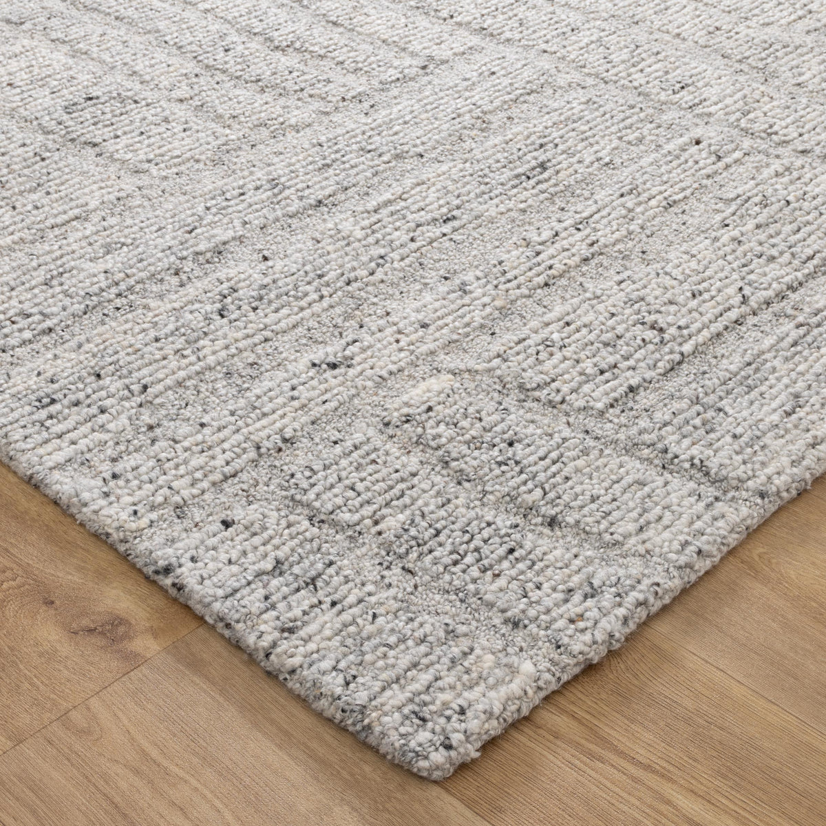 Le Canvas Arden — Grey rug, corner detail on timber floor