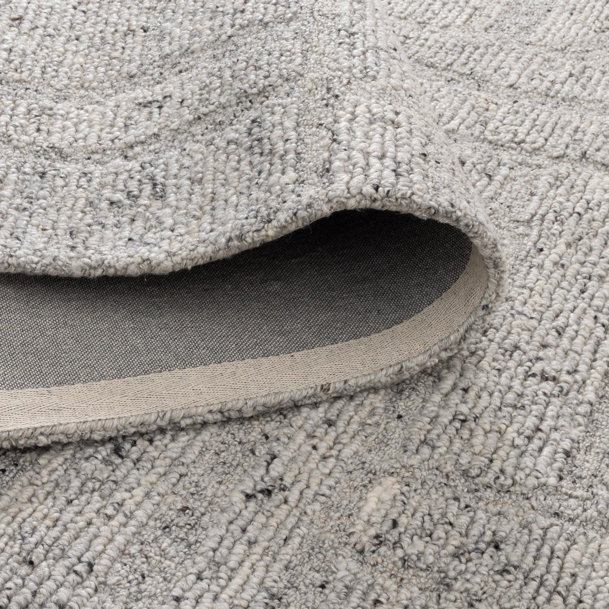 Le Canvas Arden — Grey rug, showing rug back weave and edge finish