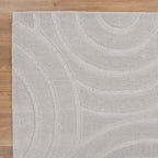 Le Canvas Liora — Light grey rug, corner and edge detail