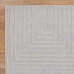 Le Canvas Wren — Light grey rug, corner detail on timber floor