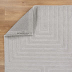 Le Canvas Wren — Light grey rug, showing rug back weave and edge finish
