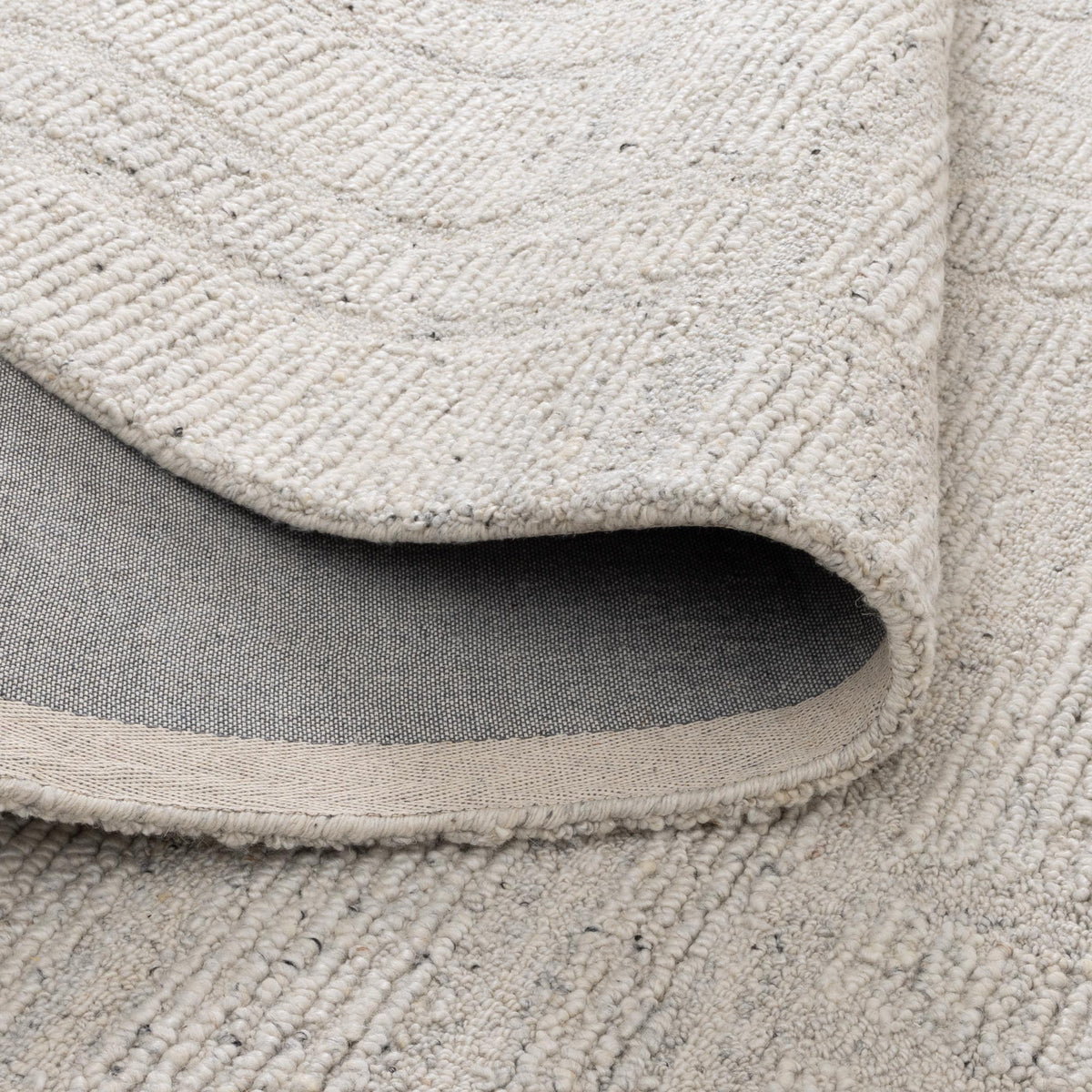 Le Canvas Lumen — Silver rug, showing rug back weave and edge finish