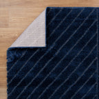 Le Canvas Cove — Navy rug, in-room view 1