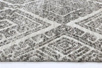 Le Canvas Fara — Grey tribal rug, corner and bound-edge detail