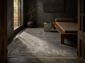 Le Canvas Halden — Grey rug styled in a living room