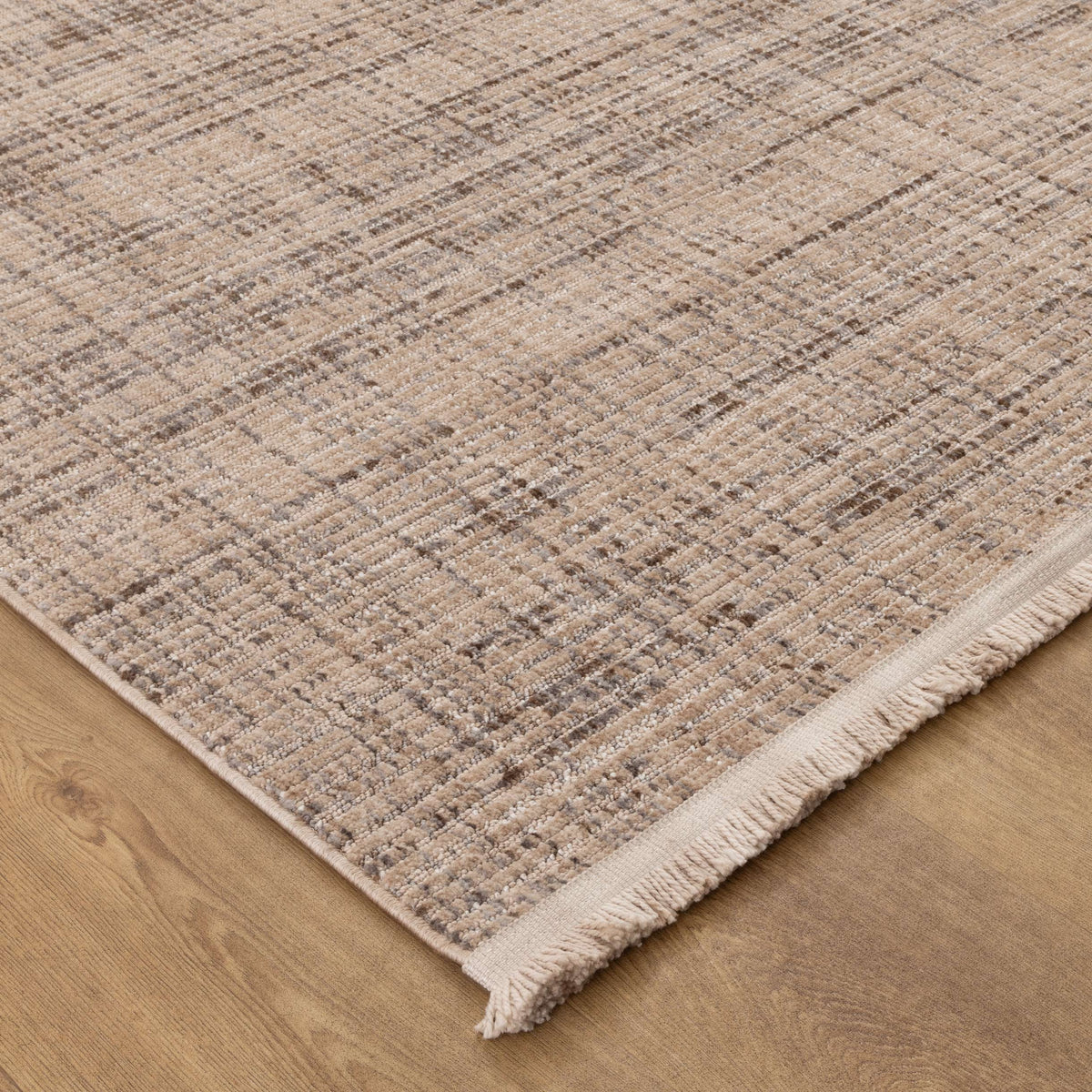 Le Canvas Elara — Beige Grey rug, corner and fringe detail on timber floor