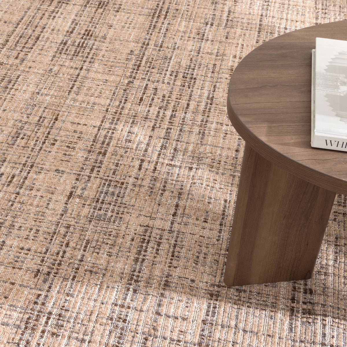 Le Canvas Elara — Beige Grey rug, close-up in a styled interior with walnut coffee table