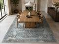 Le Canvas Sela — Light grey rug styled in a dining room