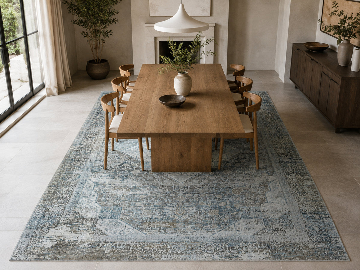 Le Canvas Sela — Light grey rug styled in a dining room