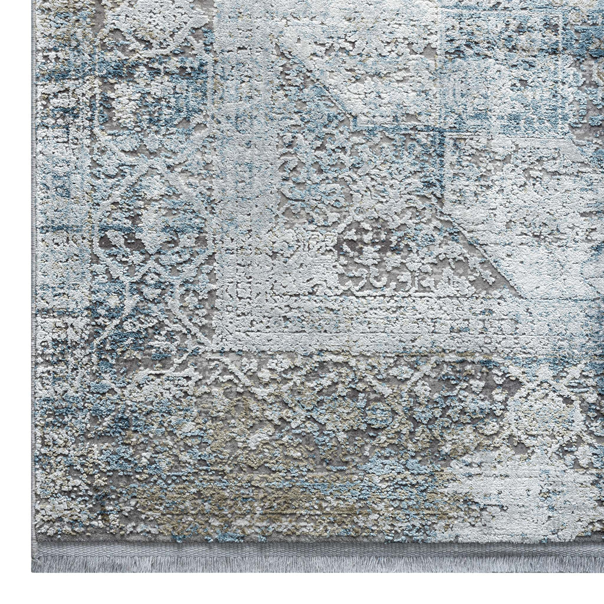Le Canvas Sela — Light grey rug, corner and fringe detail