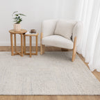 Lumen Silver wool rug styled in a neutral living room