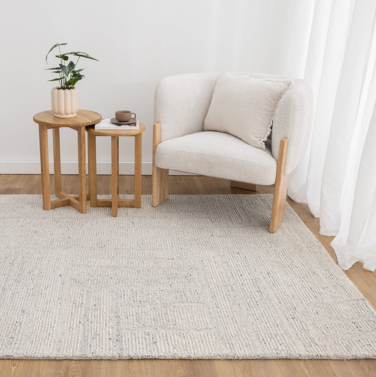 Lumen Silver wool rug styled in a neutral living room