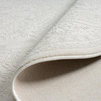 Le Canvas Eira — Ivory round rug, reverse and construction